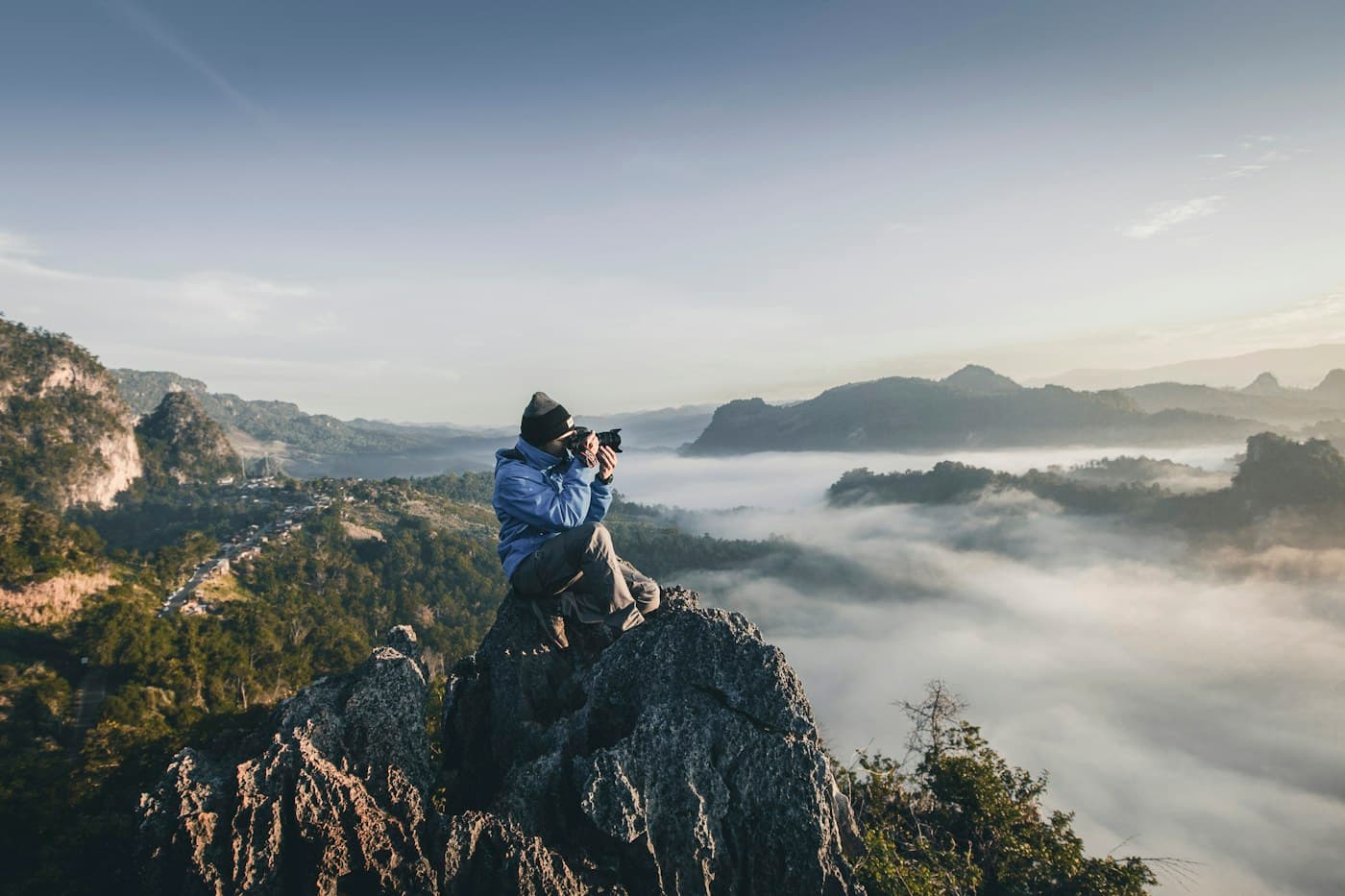 A photographer working on a mountain ridge